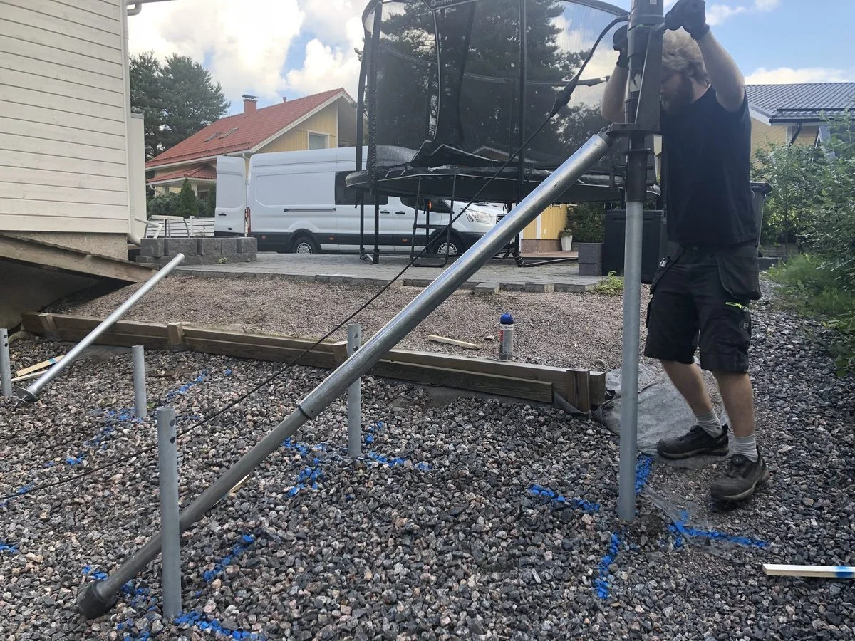 Extension boom for screw pile installation