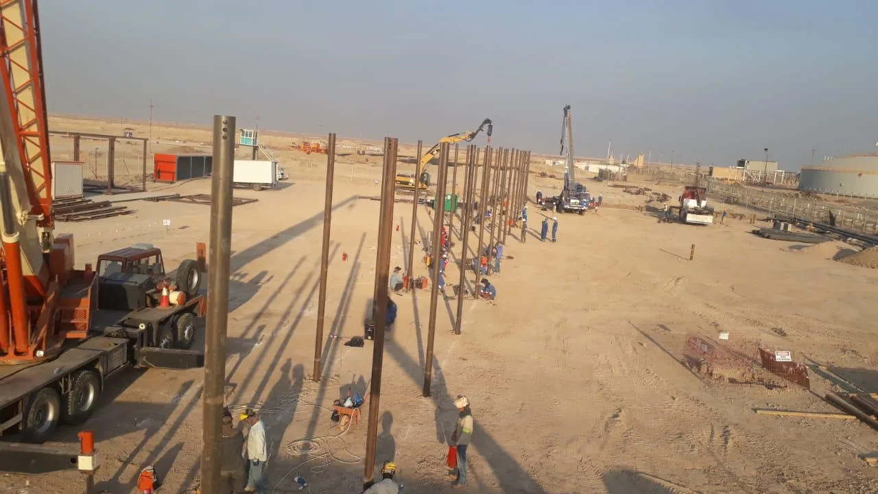 Rows of installed screw piles for pipeline supports, Basra oil field, Iraq