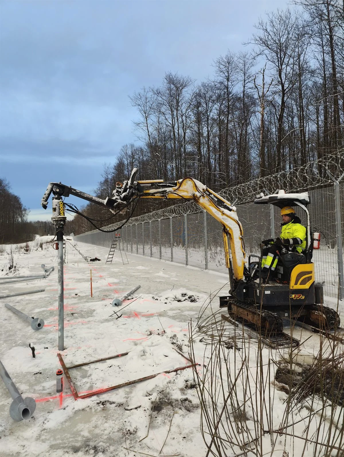 Screw pile being driven into ground